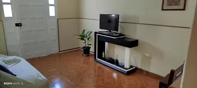 a living room with a fireplace with a tv on it at Residencial Soares in Espargos