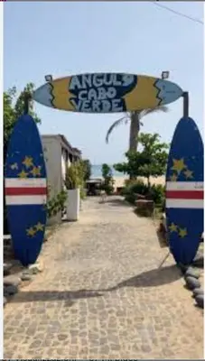 a couple of blue surfboards sitting on a sidewalk at Leme Bedje Residence in Santa Maria