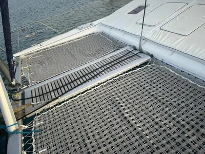 a metal bench on a boat in the water at Aaparthotel Book a Taxi Group in Prainha