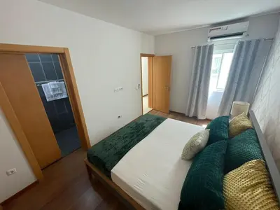 a bedroom with a large bed and a window at Our Happy Place Prainha in Praia
