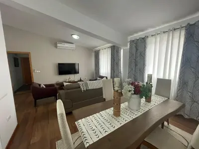 a living room with a couch and a table at Our Happy Place Prainha in Praia