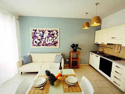 a living room with a couch and a table at Boadream Casa Duria Porta Viola in Prainha