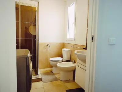 a bathroom with a toilet and a sink at Boadream Casa Duria Porta Viola in Prainha
