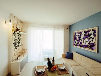 a living room with a couch and a table at Boadream Casa Duria Porta Viola in Prainha