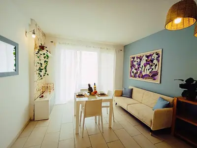 a living room with a couch and a table at Boadream Casa Duria Porta Viola in Prainha