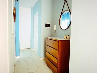 a bathroom with a wooden dresser and a mirror at Boadream Casa Duria Porta Viola in Prainha
