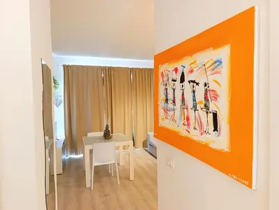 a room with a table and a painting on the wall at Boadream Casa Duria Porta Rossa in Prainha