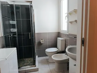 a bathroom with a toilet and a shower and a sink at Boadream Casa Duria Porta Rossa in Prainha