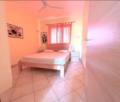 a bedroom with a bed and a window at Holiday Properties Prestige Apartments in Santa Maria