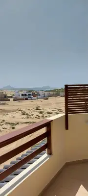 a balcony with a view of the beach at Cala da Lua apartments in Sal Rei