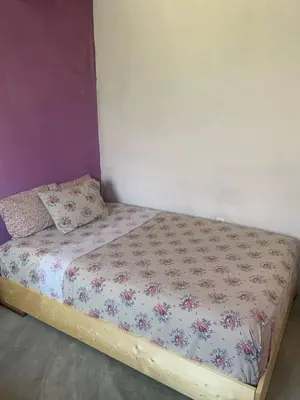 a small bed in a room with at Pousada casa Eurico in Portela