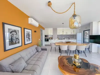 a living room with a couch and a table at Helena - Marel Bliss Apartments T3 in Mindelo