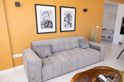 a living room with a couch and a table at Helena - Marel Bliss Apartments T3 in Mindelo