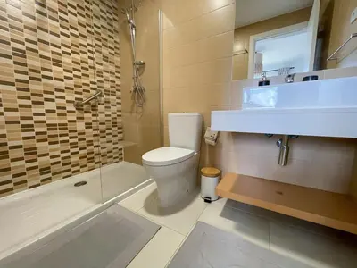a bathroom with a toilet and a sink and a tub at Helena - Marel Bliss Apartments T3 in Mindelo