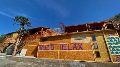 a building with the words bike relax written on it at Bangaló Buzio Relax in Portal