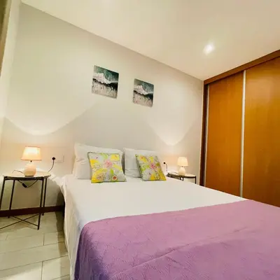 a bedroom with a large bed and two lamps at Sal Little Heart Bia Apartment 19 in Santa Maria