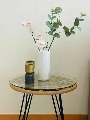 a table with a vase of flowers and a candle at Sal Little Heart Bia Apartment 19 in Santa Maria