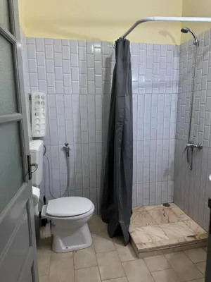 a bathroom with a toilet and a shower at Casa azul in Mindelo