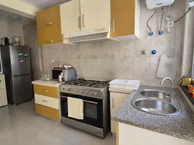 a small kitchen with a stove and a sink at Casa di Morabeza in Praia