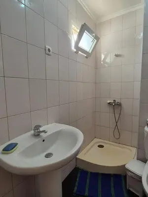 a bathroom with a sink and a toilet at Casa di Morabeza in Praia