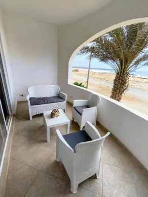 a living room with a view of the beach at Alma MIRIAM in Sal Rei