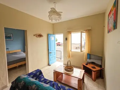 a living room with a couch and a table at Kasa Amizade in Prainha