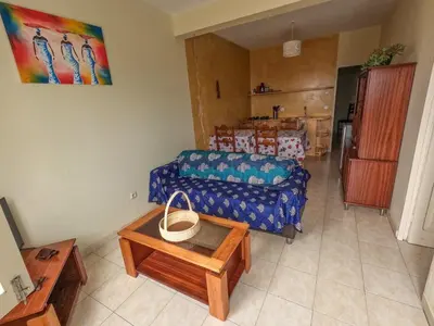 a living room with a couch and a table at Kasa Amizade in Prainha