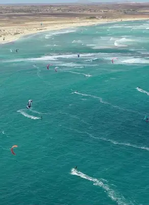 a group of people kite surfing in the ocean at Lovely Seaview Apartment Magnolia in Santa Maria