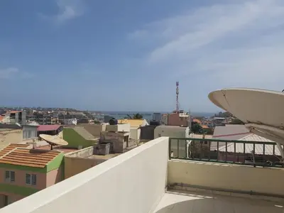 a view of a city from a balcony at Apartamentos Sossego in Praia