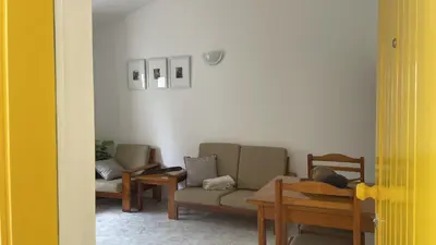 a living room with two chairs and a couch at Apartament Salim in Beirona