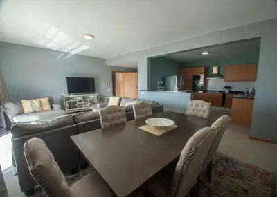 a living room with a table and a couch at Apartamentos Octane Mindelo in Mindelo
