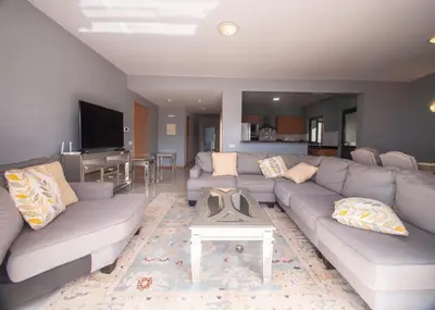 a living room with a couch and a table at Apartamentos Octane Mindelo in Mindelo