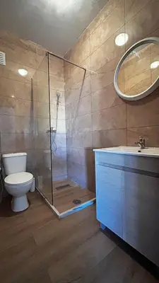 a bathroom with a shower and a toilet and a sink at Casa Fortes in Praia