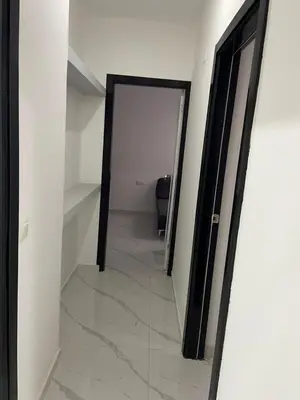 a hallway with a door leading into a room at Di Rosa Apartament in Praia