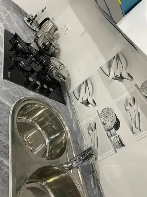 a bathroom with a toilet with a metal toilet bowl at Di Rosa Apartament in Praia