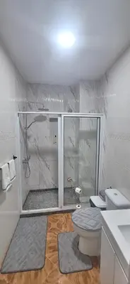 a bathroom with a shower with a toilet and a sink at Morabeza Serena in Santa Maria