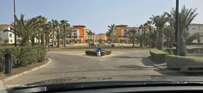 a view of a street with palm trees and buildings at Apartamento mj in Santa Maria