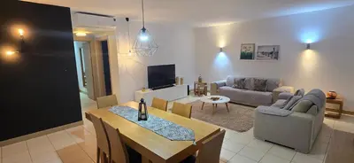 a living room with a couch and a table at Apartamento mj in Santa Maria