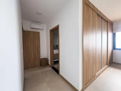 a hallway with wooden dividers in a house at Bordão Apartments in Praia