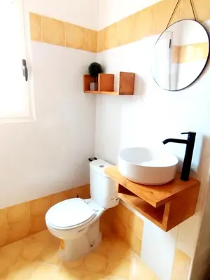 a bathroom with a toilet and a sink at Kite Sal in Santa Maria