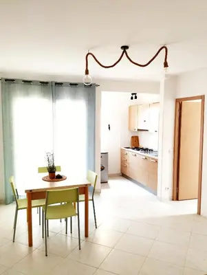 a kitchen and dining room with a table and chairs at Kite Sal in Santa Maria