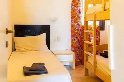 a bedroom with a bunk bed and a ladder at Aparthotel Tropical Bounty Beach L02 in Santa Maria