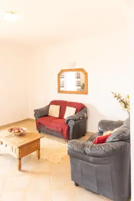 a living room with a couch and a coffee table at Santa Maria Residence in Santa Maria