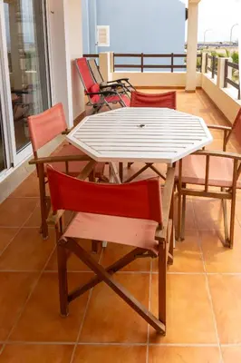 a table and chairs sitting on a balcony at Santa Maria Residence in Santa Maria