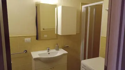 a bathroom with a sink and a mirror at Brito Place in Santa Maria