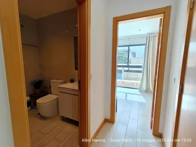 a bathroom with a toilet and a sink and a window at Albis Harena - In Sal in Santa Maria