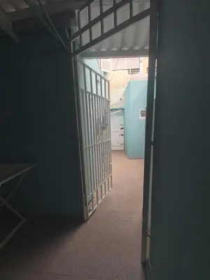 an open door to a room with a refrigerator at FeliGrab in Mindelo