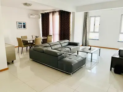 a living room with a couch and a table at Douceur de Vie in Praia