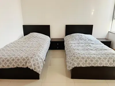 two beds sitting next to each other in a room at Douceur de Vie in Praia
