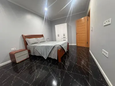 a bedroom with a bed in a room at Apartamento mais Carro George Mendes in Praia